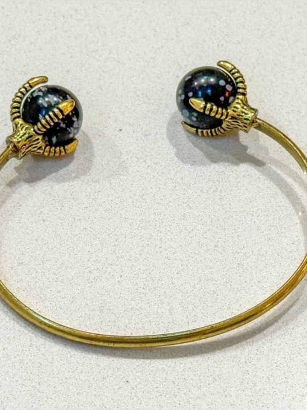 Gold Open Cuff Bracelet with Black Galaxy Bead Ends